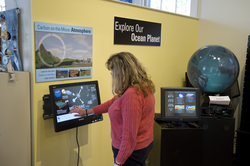 Kathy Patterson demonstrates new Carbon Cycle kiosk at the Exhibit Center.