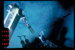 Manipulator ready to take a tube core viewed during Alvin dive 1012.