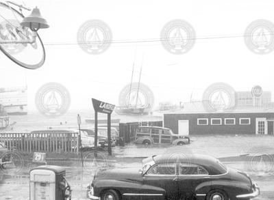 Hurricane Carol, front of Landfall restaurant, steamship at left.
