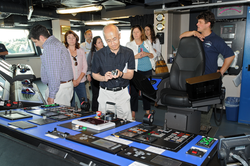 Captain Mike Hoshlyk showing NSF associates the bridge on R/V Sikuliaq.