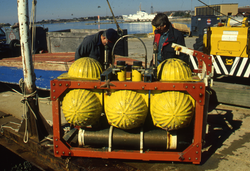 Hardhat flotation packages undergoing testing at the WHOI dock.