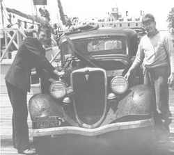 Maurice Ewing with his brother Bob on dock with car "Floozy-Belle"