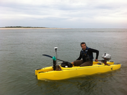 Peter Traykovski in his catamaran kayak outfitted with scientific equipment.