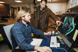 Calvin Quigley and Keston Smith examine a hydrodynamic model.