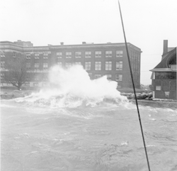 Wave crashing over seawall in Woods Hole during 1938 hurricane.