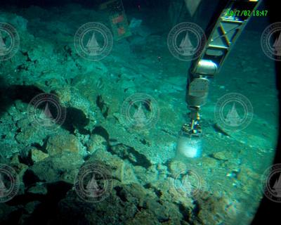 Alvin manipulator using a corer to sample during Alvin dive 3814.