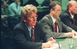 Bill Curry and Philip Mote speaking at a Senate hearing