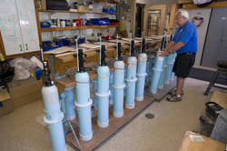 Bob Tavares arranging SOLO II Floats on a rack in the lab.