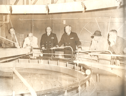 Paul, the Assistant Secretary of the Navy, and unidentified others