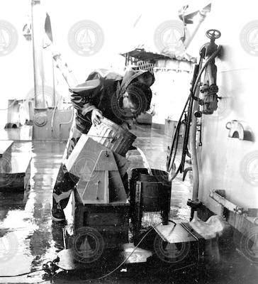 Rudy Scheltema with dredge sample on deck of Chain