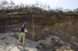 Stephanie Madsen recording data at sediment sampling site.