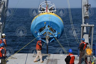John Kemp (center) directing the deployment of an OOI surface buoy.