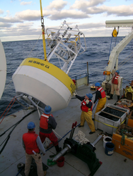 Preparing the CLIMODE surface buoy for deployment.