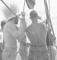 George Erlanger and others lowering coring tube.