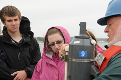 Bruce Tripp teaching students about Niskin bottle water sampling.