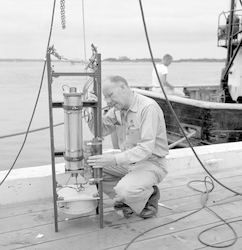 Harold Edgerton working on pinger at WHOI Dock