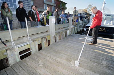 Bernhard Peucker-Ehrenbrink demonstrating water sampling techniques.