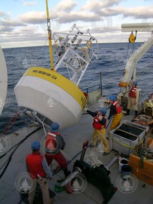 Preparing the CLIMODE surface buoy for deployment.