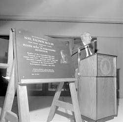 Noel McLean with dedication plaque for McLean Laboratory.