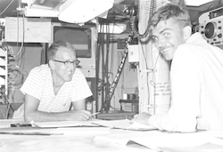Dick Tagg and Dick Chase working in lab aboard Chain
