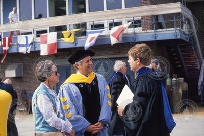 The Hollisters and Henry Dick talking at the Joint Program Commencement.