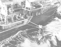 Fritz Hess being transferred via highline from USS Hazelwood to Atlantis II