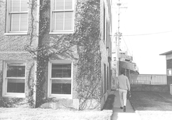 Carl Bowin walking towards R/V Chain, next to Bigelow building