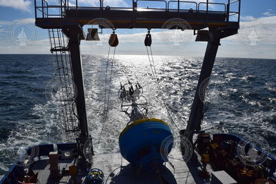 Surface buoy stowed on Armstrong's fantail during transit.