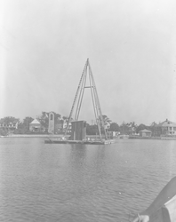 Euphausia Raft with tower moored in Eel Pond.