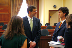 Scott Doney talking with attendees prior to hearing.