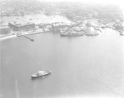 Aerial view of Woods Hole dock with Bear in harbor