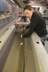 Dara Tebo testing a cable in the Mooring Lab.