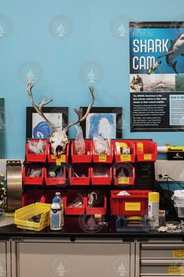 Equipment and humor stowed at a Scibotics lab work bench.