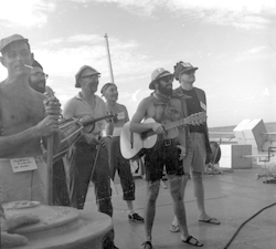 Group with musical instruments at line crossing