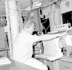 Unidentified man working in top lab