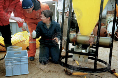 Rindy Ostermann unloading a sediment trap full of samples.