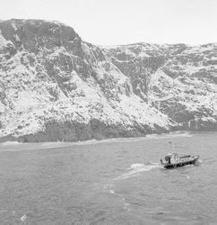 View of terrain near Godthaab, Greenland, ship in foreground