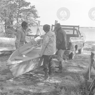 Howard Sanders and others examining oil spill.