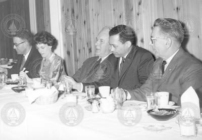 Columbus Iselin, center, at unidentified dinner.