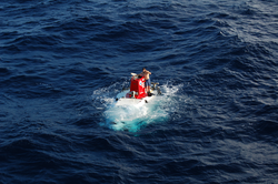 Alvin breaks the surface, ready for recovery.