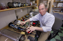 Norm Farr in the lab with Optical Modem components.