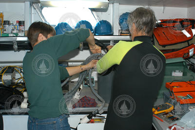Heidi Sosik and Rob Olson working on the flow cytometer aboard Tioga.