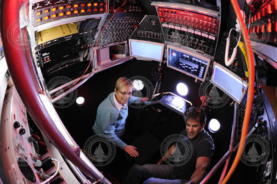 Bruce Strickrott showing Susan Avery around the inside of the Alvin sphere.