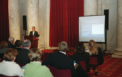 Ruth Curry speaking at the congressional briefing.