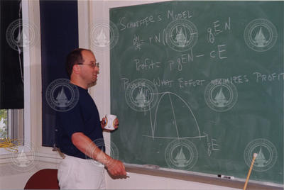 Mike Neubert at chalkboard.