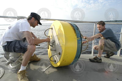 Rocky Geyer and Dave Ralston disassemble a mooring.