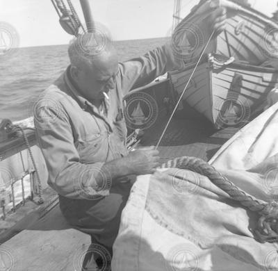 Arvid Karlson mending sail on the Atlantis.