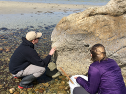 JP students Kevin Archibald and Chrissy Hernandez examine evidence of zonation on a rock.