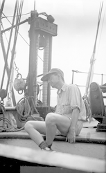Marshall Schalk, geologist sitting on deck