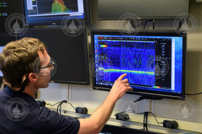 Dan Lizarralde examining EK80 echosounder data on a monitor.